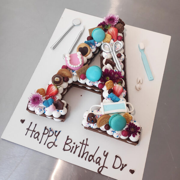کیک حروف تم دندان پزشک اجرا شده توسط نگار رزاقی